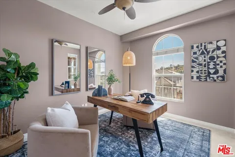 a bedroom with bed and window