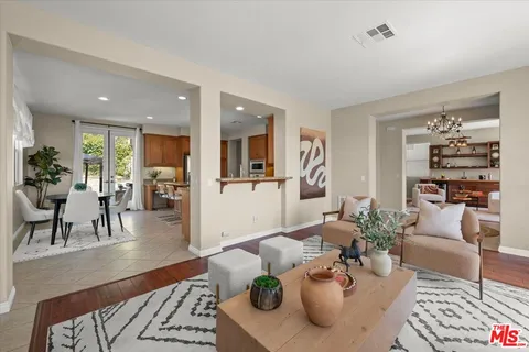 a view of a patio with table and chairs potted plants