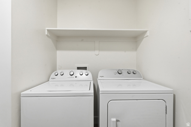 1173 West 1870 South Logan, UT 84321 - Photo 20 of 33 Laundry area with a built-in shelf and white walls