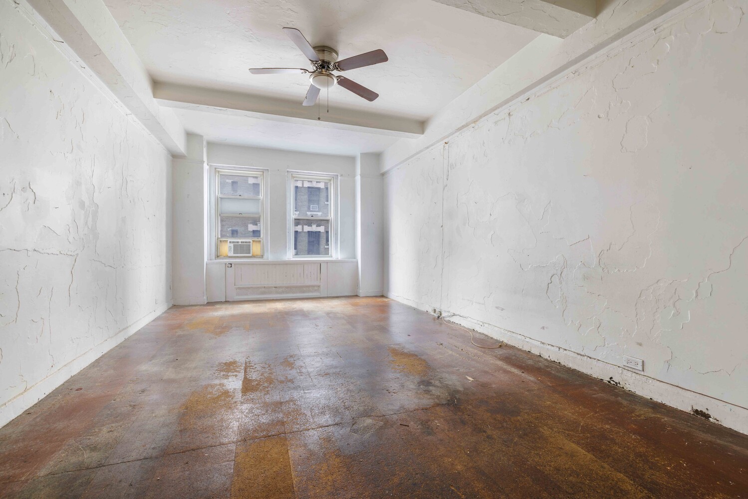 310 Riverside Drive, Unit 511 Manhattan, NY 10025 - Photo 2 of 11 a view of an empty room with a window