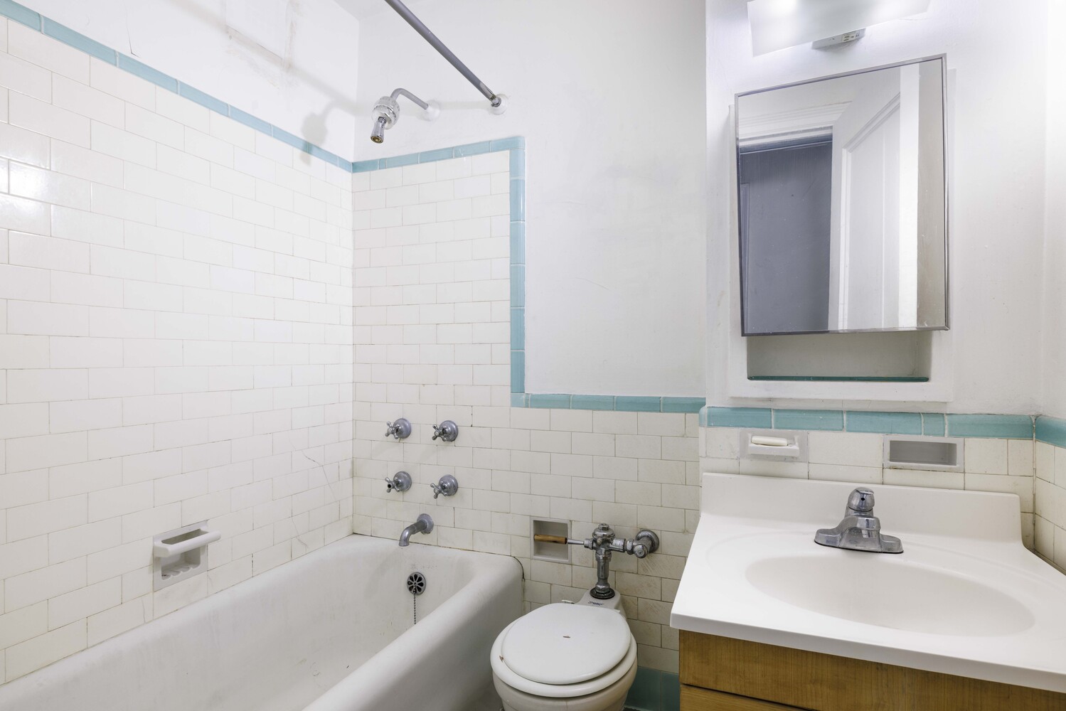 310 Riverside Drive, Unit 511 Manhattan, NY 10025 - Photo 9 of 11 a bathroom with a sink toilet and bathtub