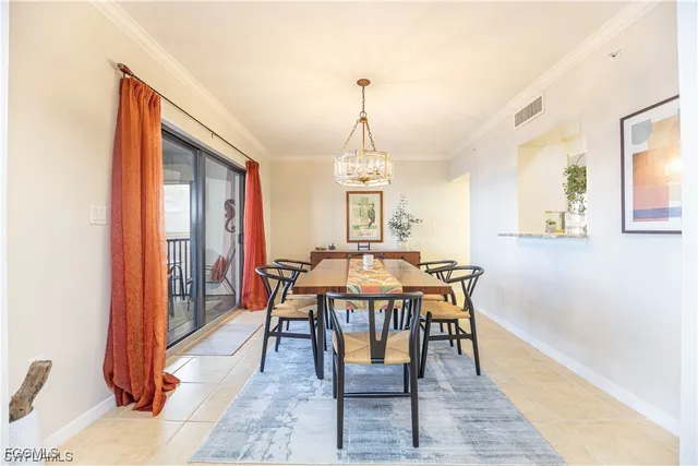 a view of a dining room with furniture and window
