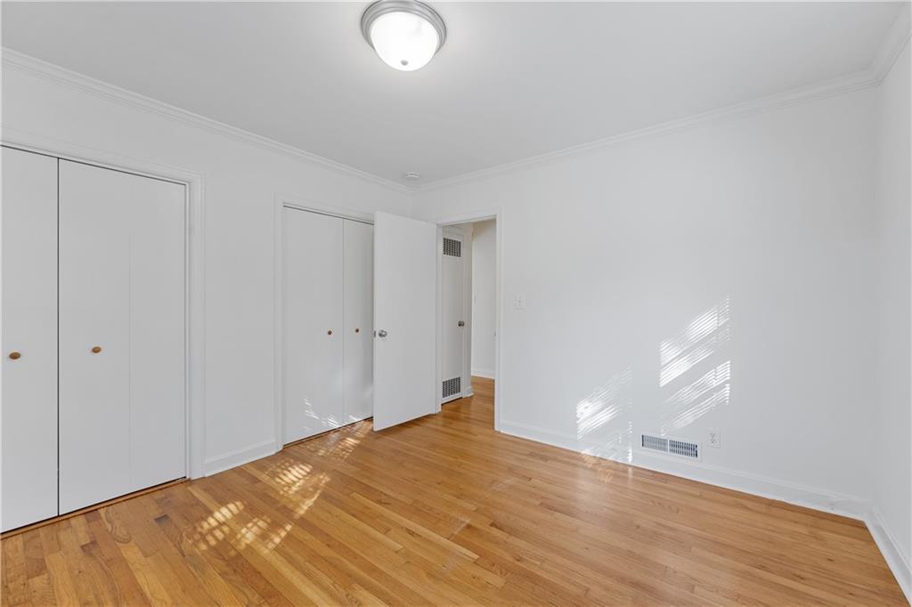 56 Mobile Avenue Northeast, Unit B Atlanta, GA 30305 - Photo 17 of 21 a view of empty room with wooden floor