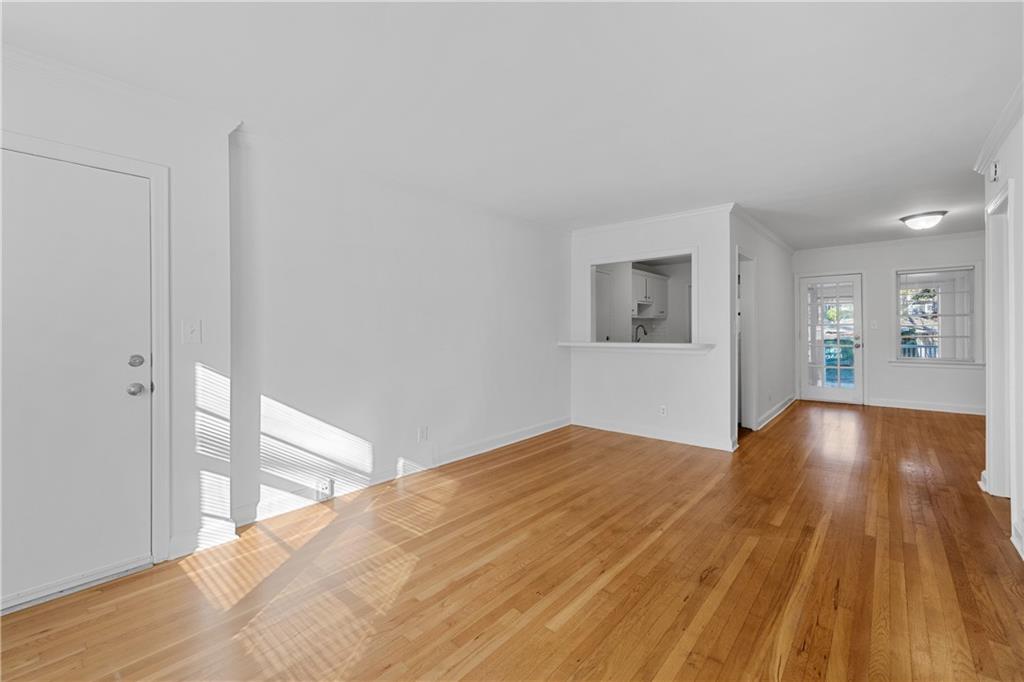 56 Mobile Avenue Northeast, Unit B Atlanta, GA 30305 - Photo 4 of 21 a view of empty room with wooden floor