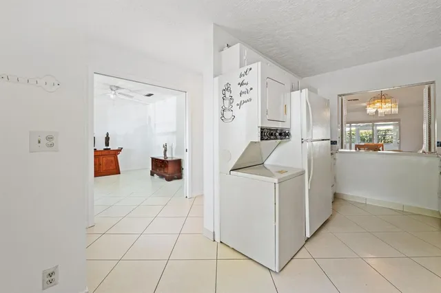 a storage room with cabinets and washer