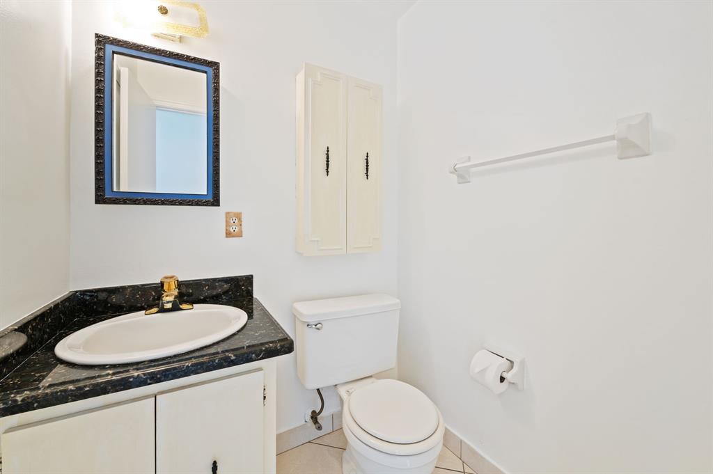 1271 Northwest 18th Avenue, Unit 5C Delray Beach, FL 33445 - Photo 14 of 36 a bathroom with a sink and a toilet