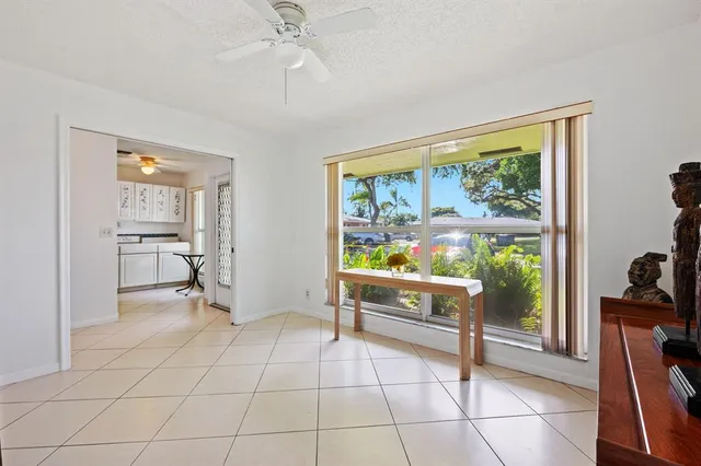 a room with lots of furniture and a large window