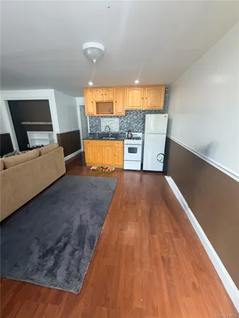 a living room with a couch and a large window