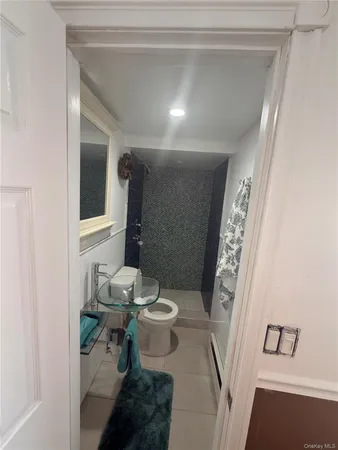 a view of a door and chair in wooden floor