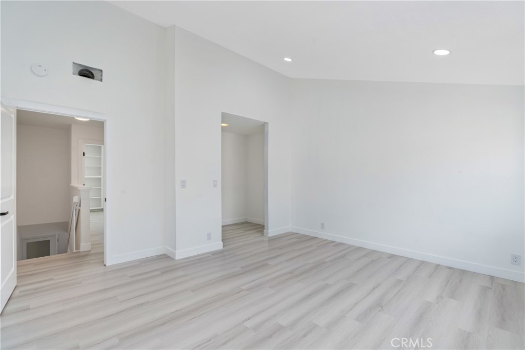 936 Fairway, Unit 8 Grand Terrace, CA 92324 - Photo 20 of 26 a view of an empty room with wooden floor