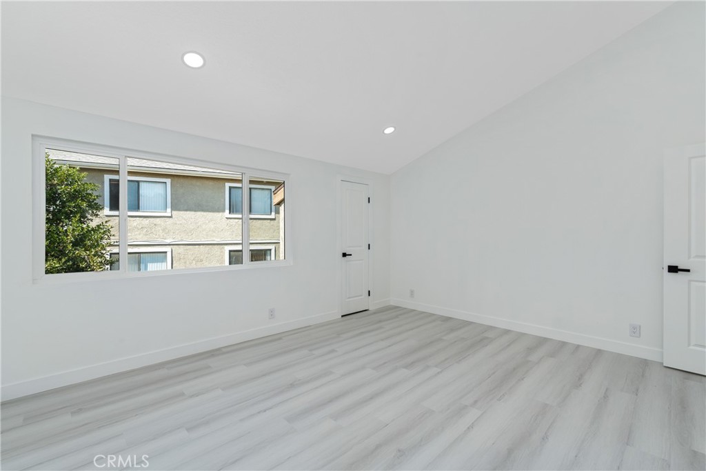 936 Fairway, Unit 8 Grand Terrace, CA 92324 - Photo 22 of 26 wooden floor in an empty room with a window