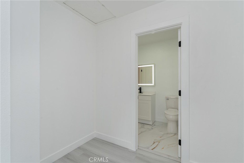 936 Fairway, Unit 8 Grand Terrace, CA 92324 - Photo 23 of 26 a bathroom with a glass shower door