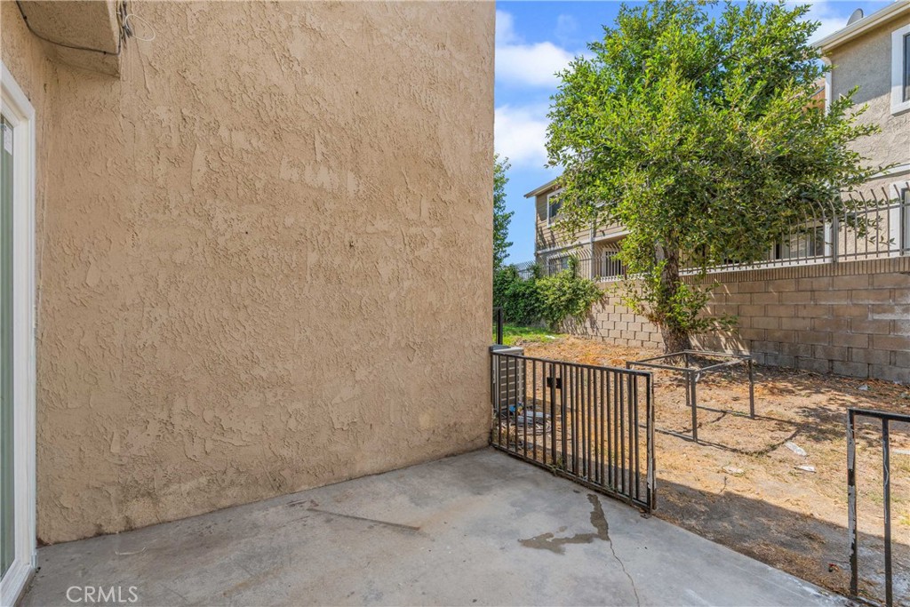 936 Fairway, Unit 8 Grand Terrace, CA 92324 - Photo 25 of 26 a view of a porch with wooden fence