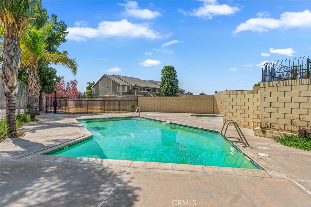 936 Fairway, Unit 8 Grand Terrace, CA 92324 - Photo 26 of 26 a view of a garden with a houses in the background