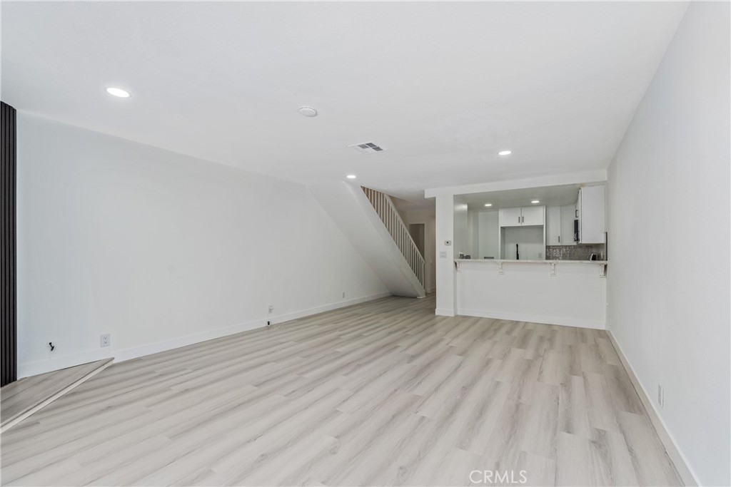 936 Fairway, Unit 8 Grand Terrace, CA 92324 - Photo 7 of 26 a view of empty room with wooden floor