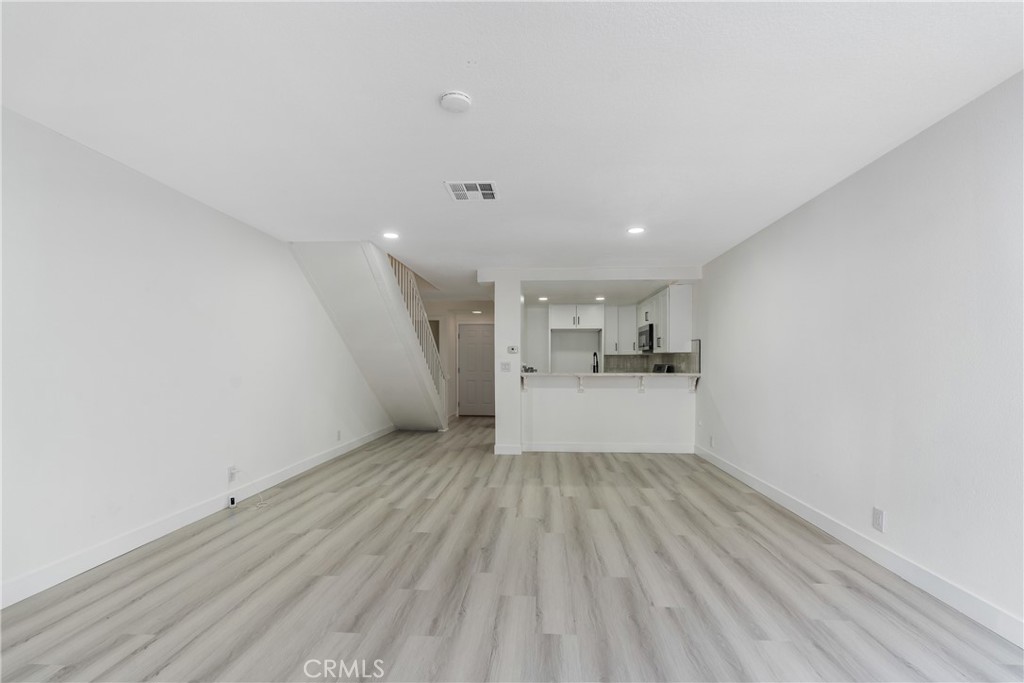 936 Fairway, Unit 8 Grand Terrace, CA 92324 - Photo 8 of 26 a view of a kitchen with wooden floor