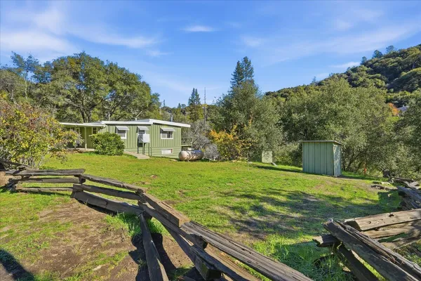 a view of a backyard with a garden