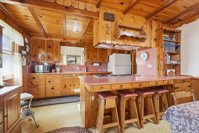 a dining room with a table and chairs