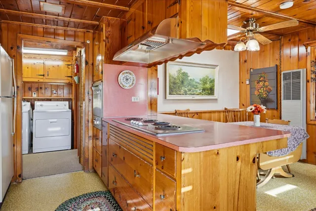 a kitchen with a stove and a refrigerator