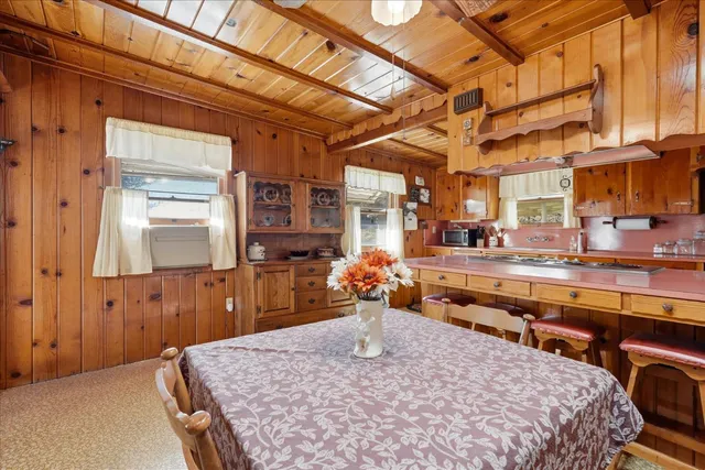 a view of a chair and tables in the balcony