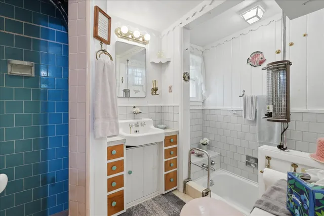a view of a porch with wooden floor and iron stairs