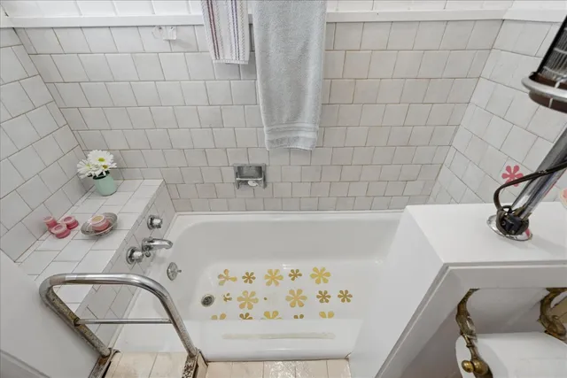 a bathroom with a bathtub and sink