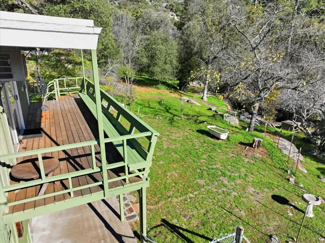 a view of balcony with wooden floor