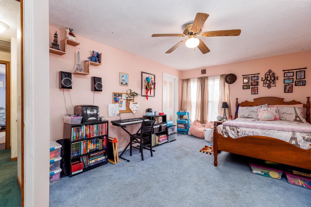 511 North Salisbury Davis, IL 61019 - Photo 18 of 24 a bedroom with furniture and a book shelf