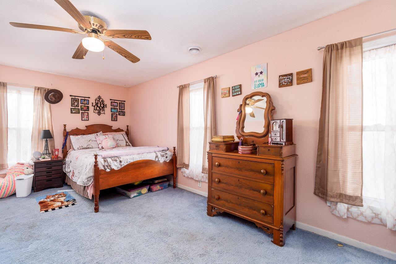 511 North Salisbury Davis, IL 61019 - Photo 19 of 24 a bedroom with a bed and a dresser