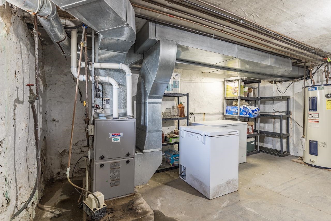 511 North Salisbury Davis, IL 61019 - Photo 21 of 24 a room with water heater and a refrigerator
