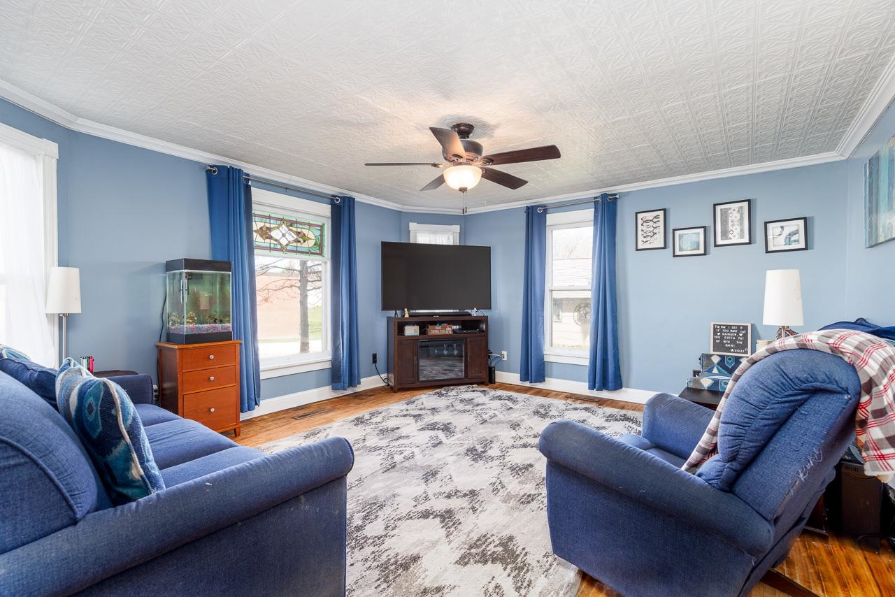 511 North Salisbury Davis, IL 61019 - Photo 5 of 24 a living room with furniture and a flat screen tv