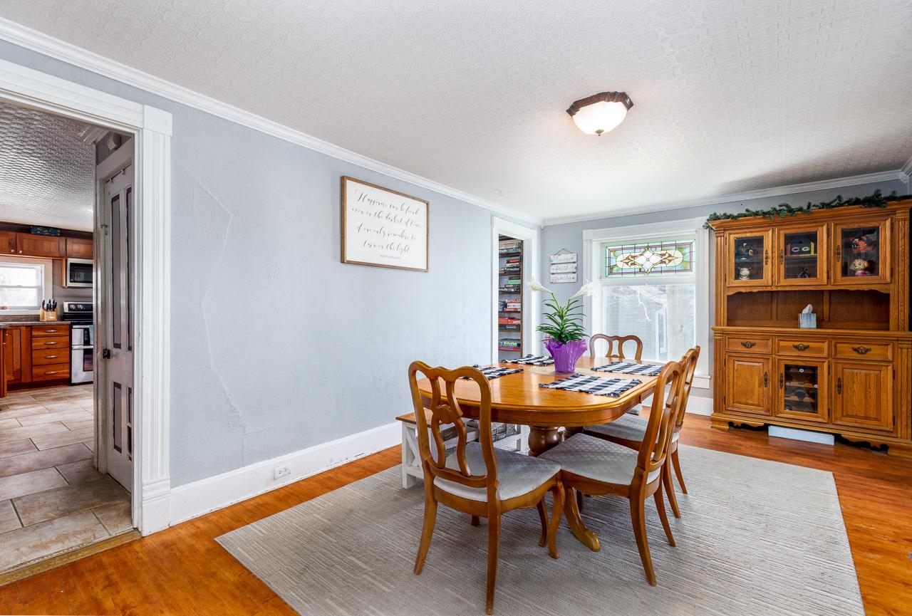511 North Salisbury Davis, IL 61019 - Photo 8 of 24 a view of a dining room with furniture and wooden floor