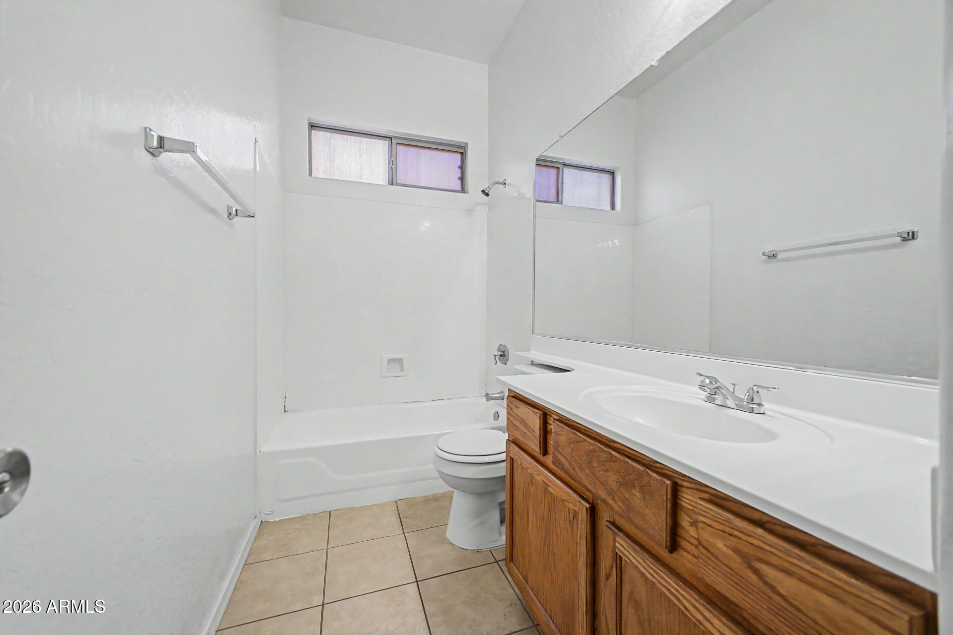 11199 West Monte Vista Road Avondale, AZ 85392 - Photo 22 of 36 a bathroom with a sink a toilet and shower