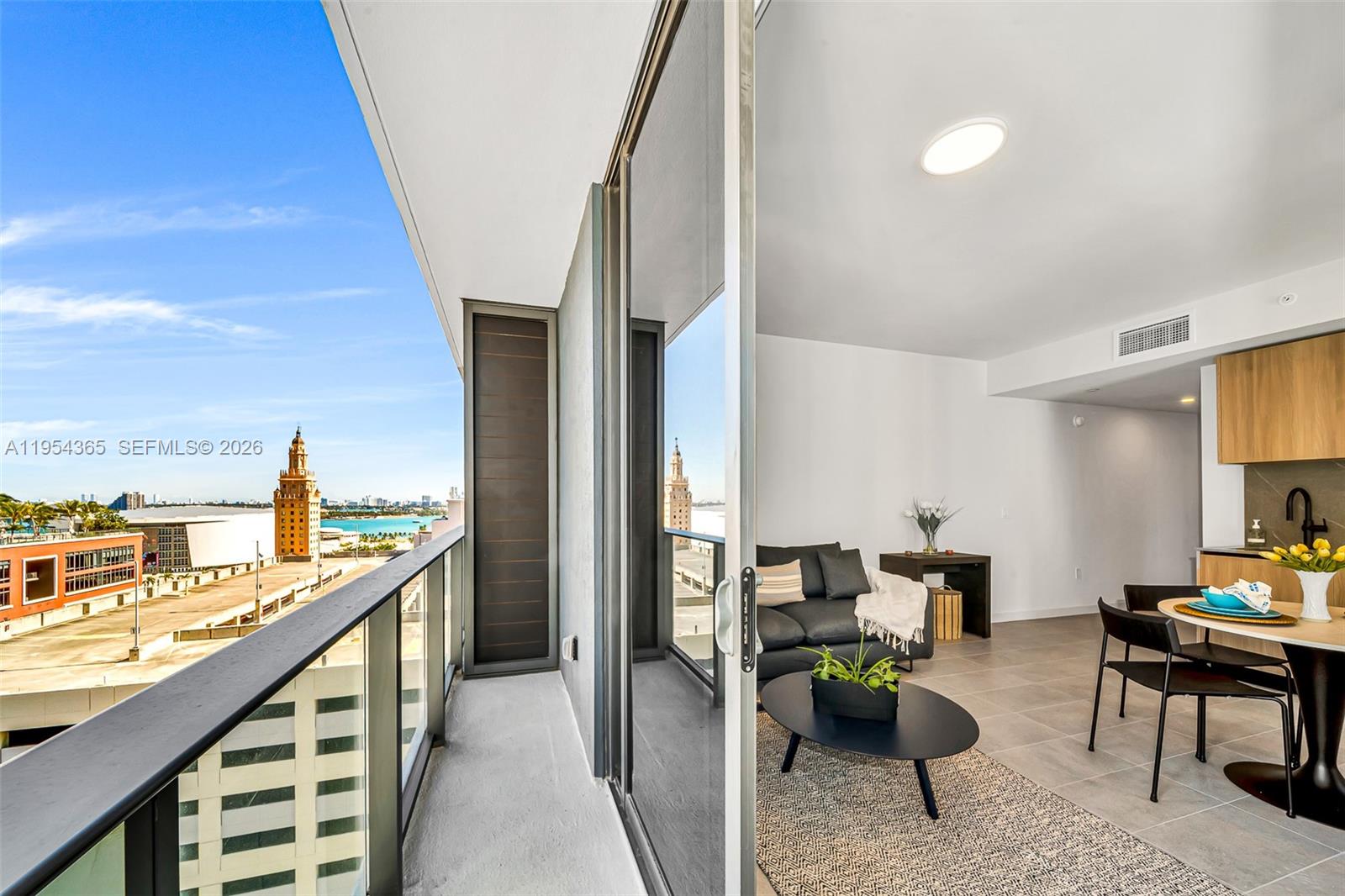 121 Northeast 5th Street, Unit 1608 Miami, FL 33132 - Photo 1 of 31 a living room with furniture and a table
