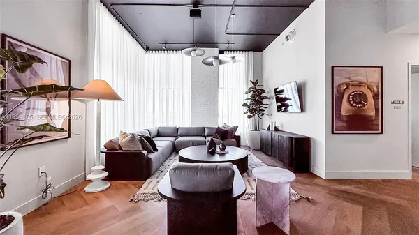 a living room with furniture and a window
