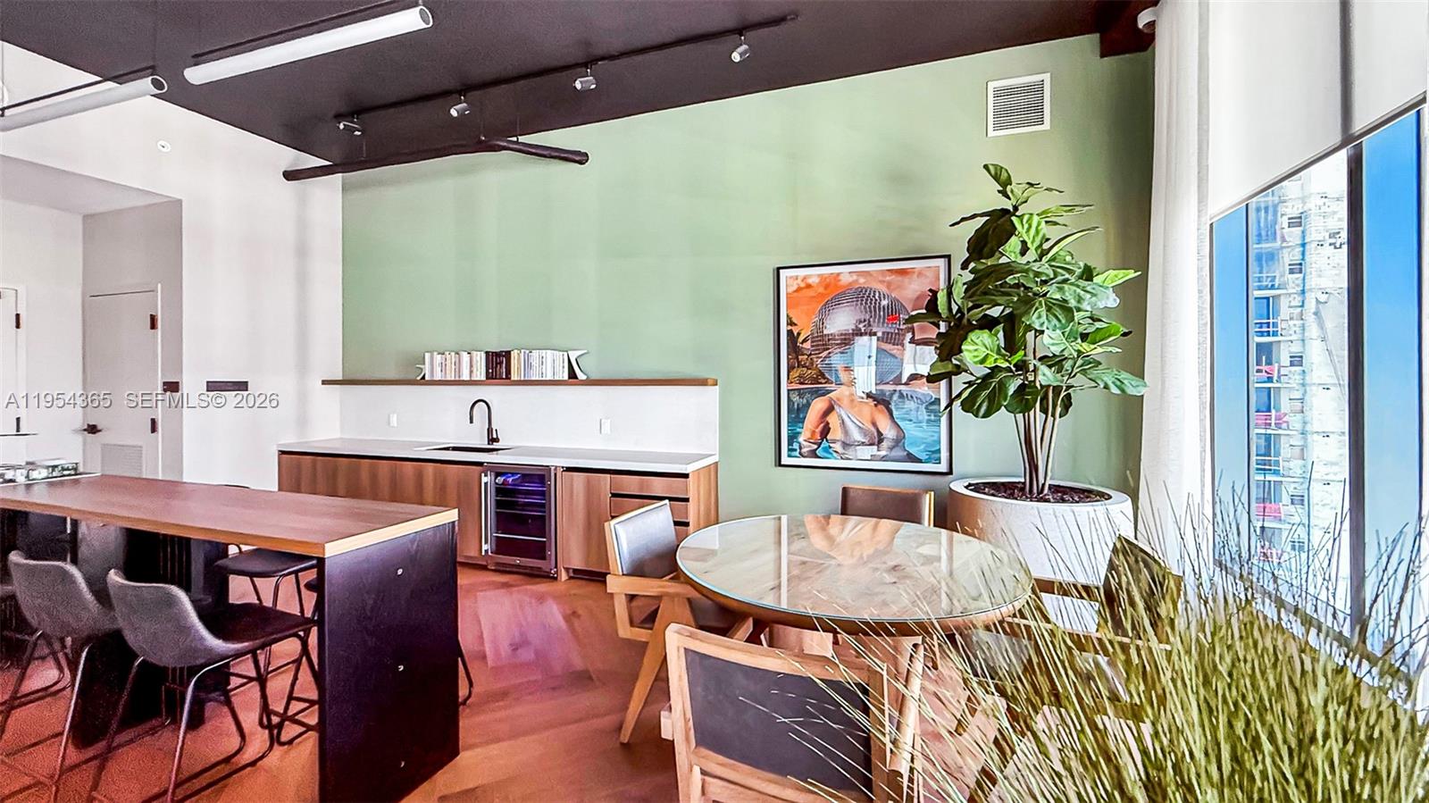 121 Northeast 5th Street, Unit 1608 Miami, FL 33132 - Photo 19 of 31 a dining room with furniture and wooden floor