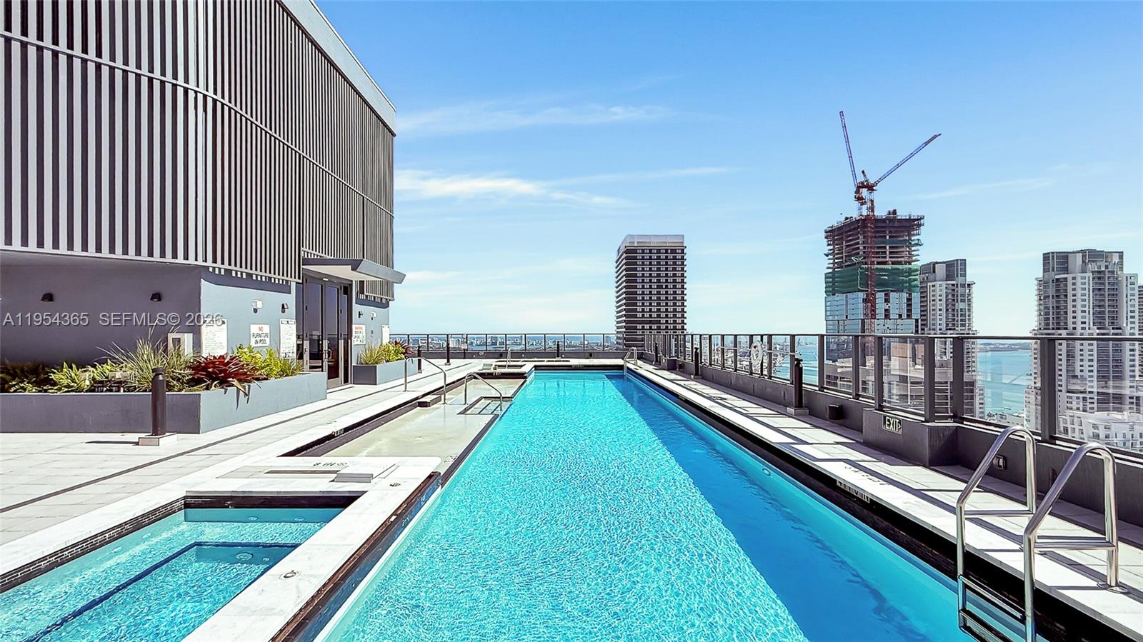 121 Northeast 5th Street, Unit 1608 Miami, FL 33132 - Photo 29 of 31 a view of a house with swimming pool