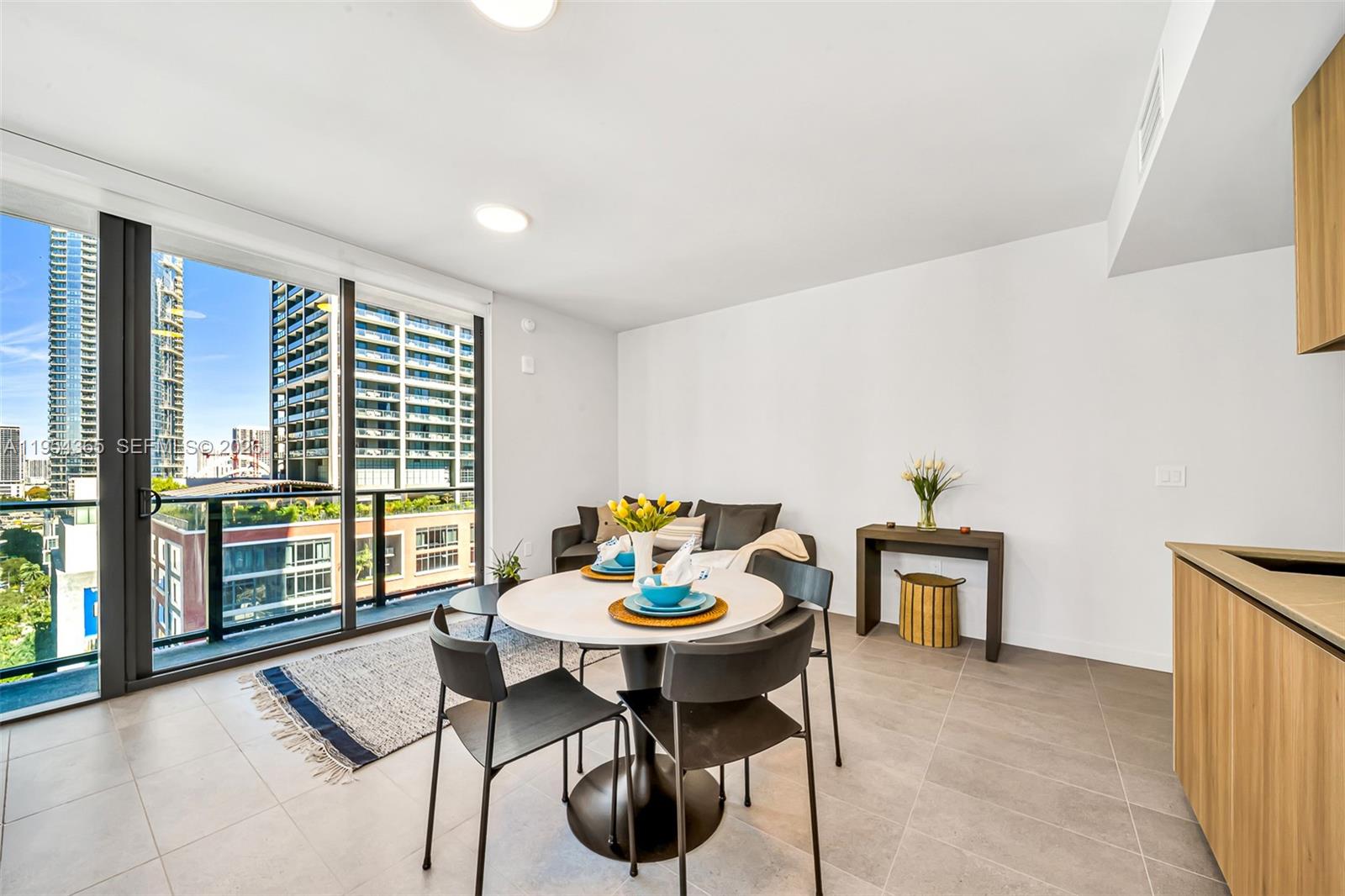 121 Northeast 5th Street, Unit 1608 Miami, FL 33132 - Photo 6 of 31 a living room with furniture and window