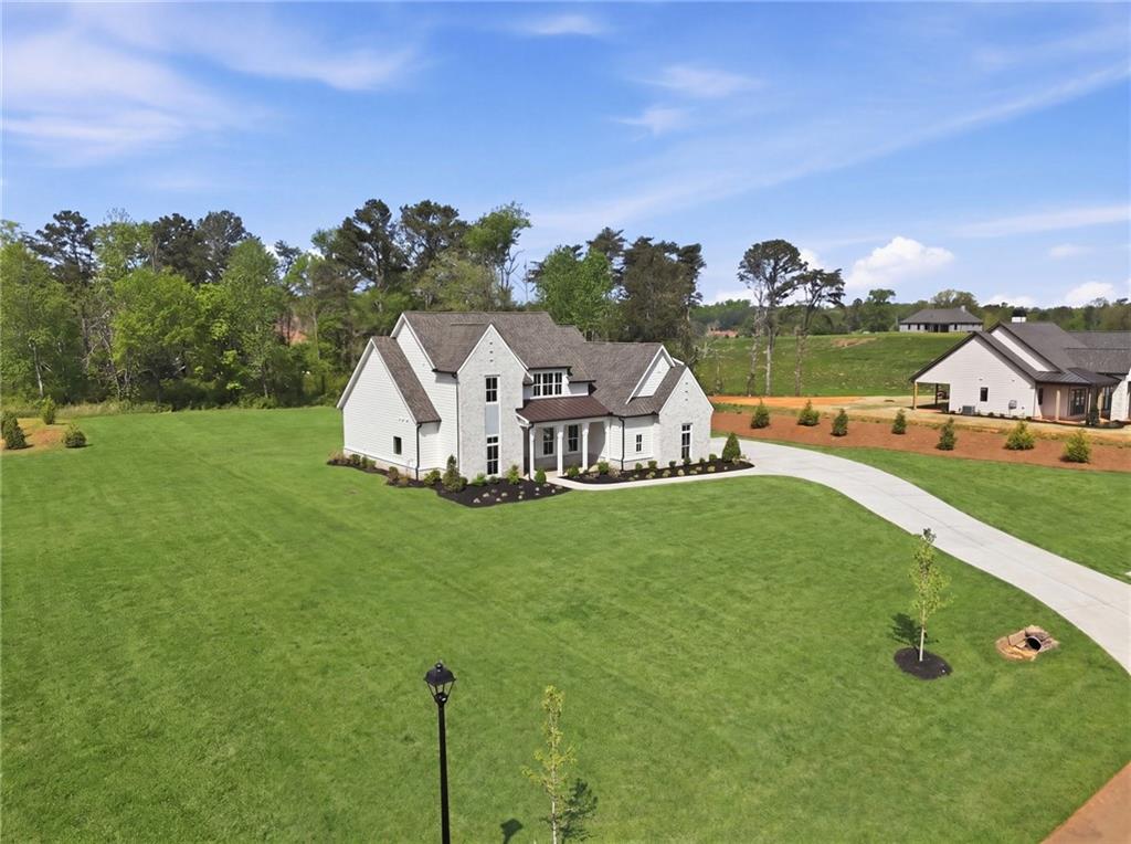 158 Palisade Drive Rydal, GA 30171 - Photo 69 of 75 a view of a green field with house in the background