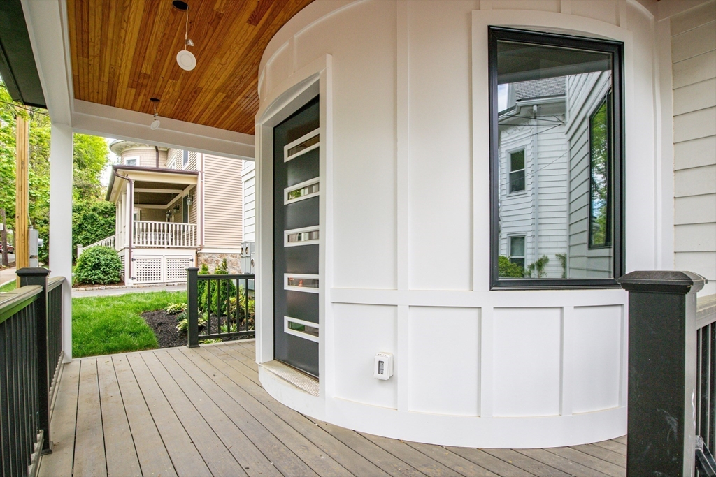 116 Thorndike Street, Unit 1 Brookline, MA 02446 - Photo 4 of 17 a view of a house with a porch