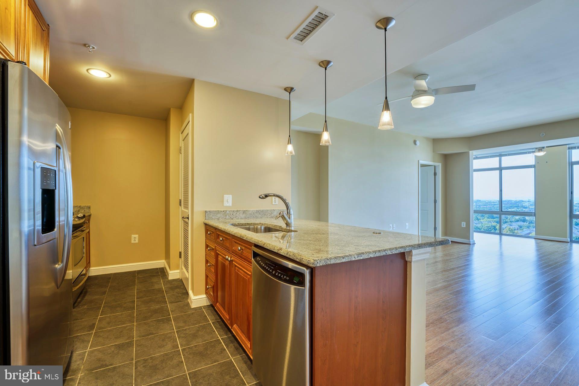 11990 Market Street, Unit 1314 Reston, VA 20190 - Photo 11 of 44 NICELY APPOINTED KITCHEN -GRANITE & STAINLESS APPS
