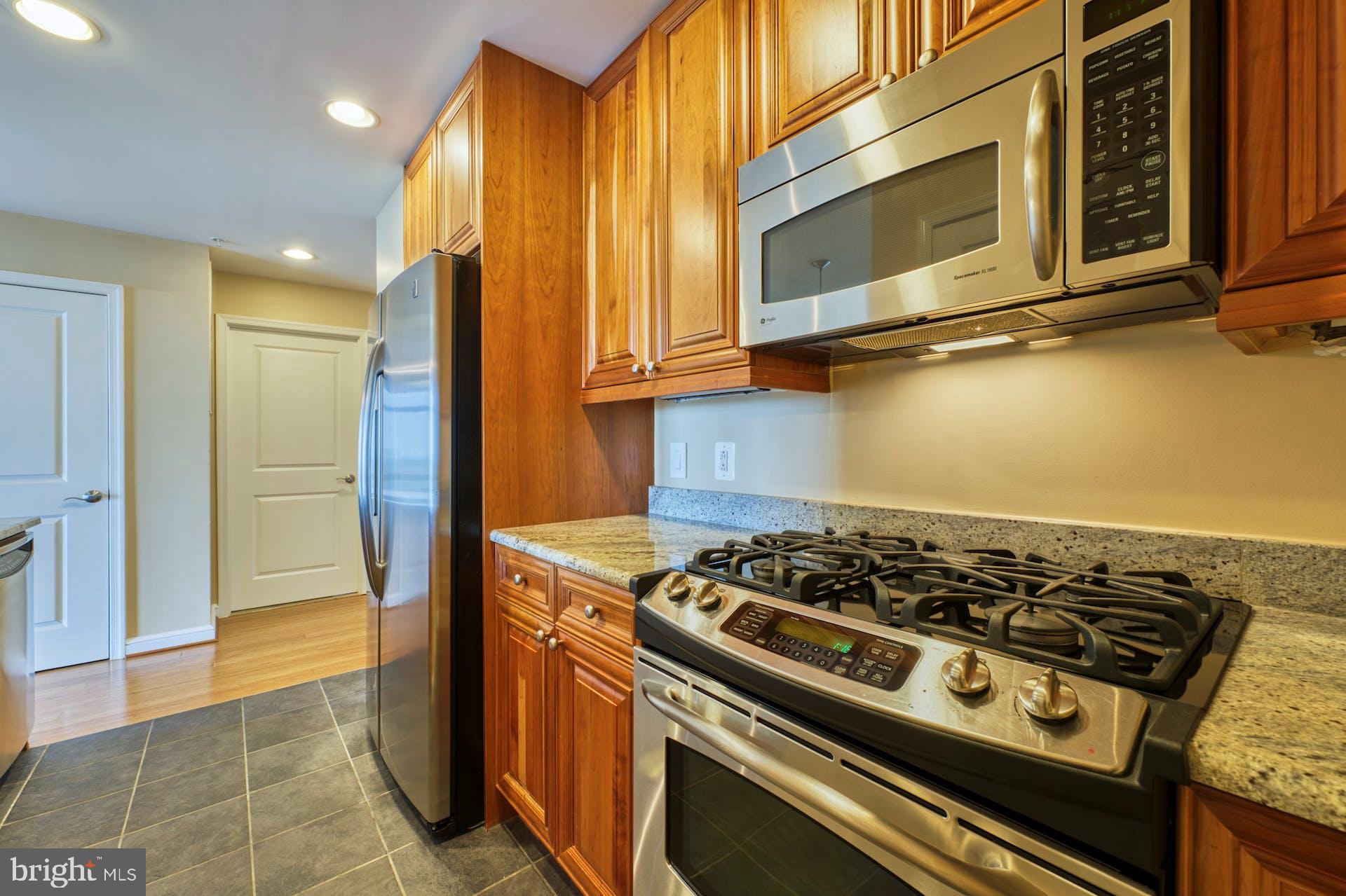 11990 Market Street, Unit 1314 Reston, VA 20190 - Photo 15 of 44 FULL SIZE GAS STOVE AND MICROWAVE