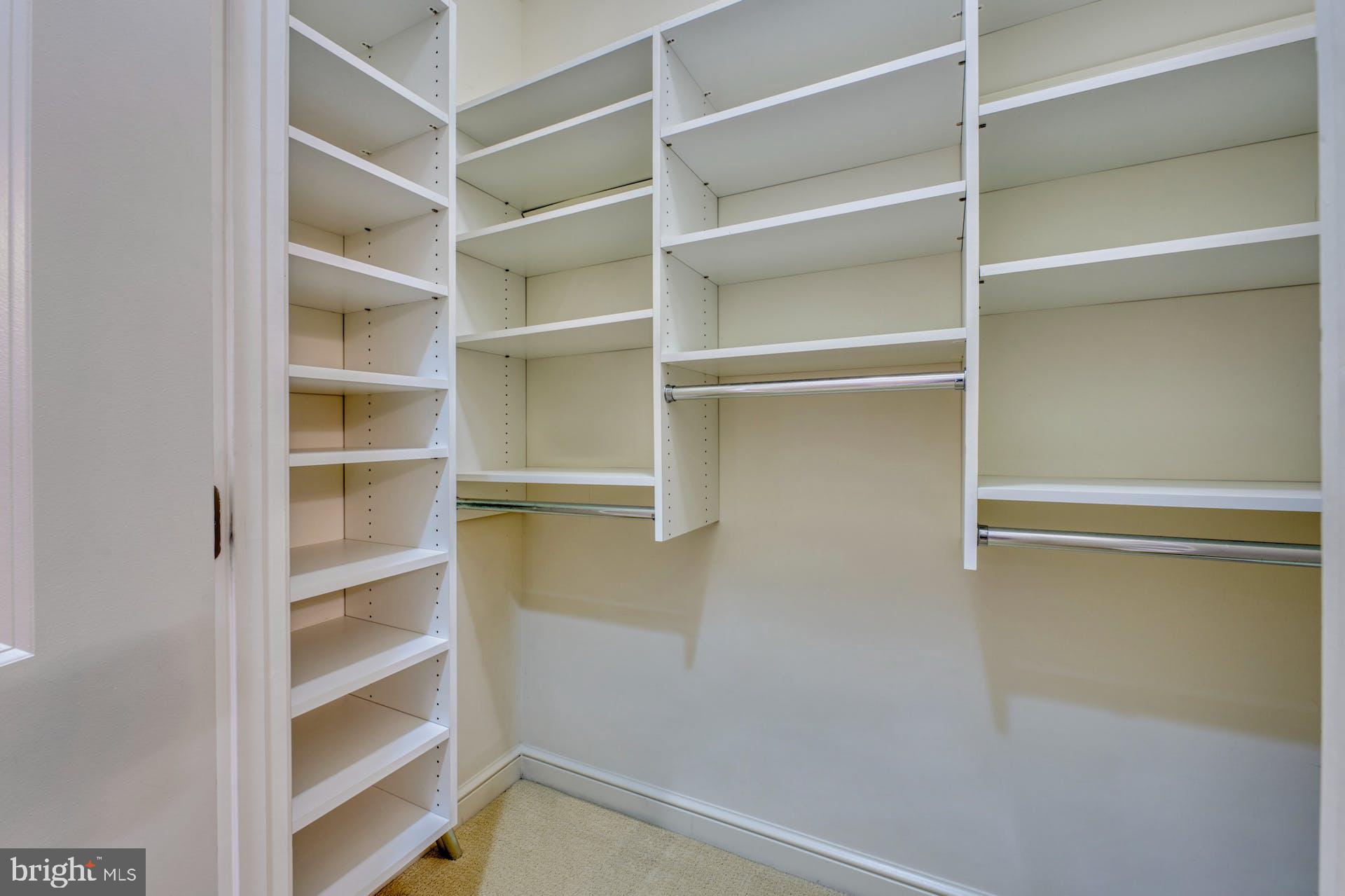 11990 Market Street, Unit 1314 Reston, VA 20190 - Photo 25 of 44 WALK-IN CLOSET WITH BLT-INS BEDROOM #1