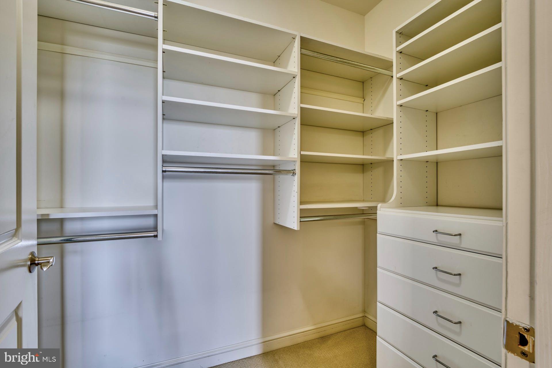 11990 Market Street, Unit 1314 Reston, VA 20190 - Photo 32 of 44 WALK-IN CLOSET WITH BLT-INS-BEDROOM #2