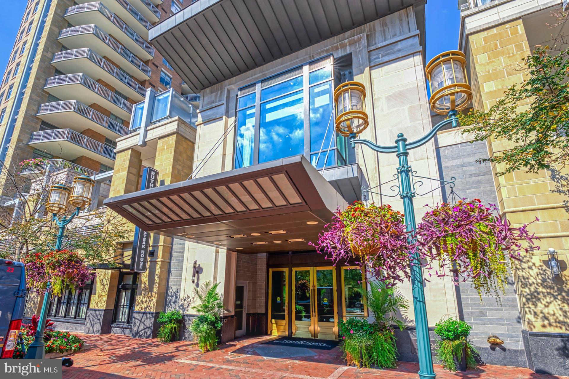 11990 Market Street, Unit 1314 Reston, VA 20190 - Photo 7 of 44 COVERED ENTRANCE INTO THE MIDTOWN RESTON BUILDING