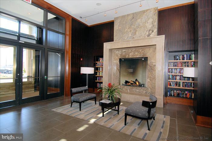 11990 Market Street, Unit 1314 Reston, VA 20190 - Photo 8 of 44 FOYER OF MIDTOWN RESTON CONDO WITH GAS FIREPLACE