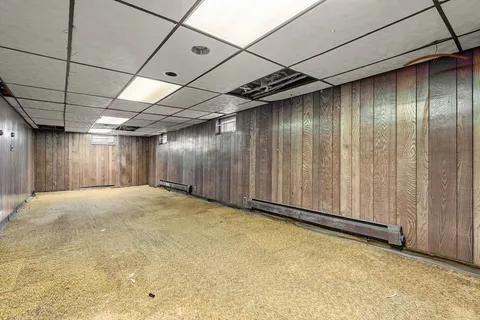 a view of a room with wooden walls