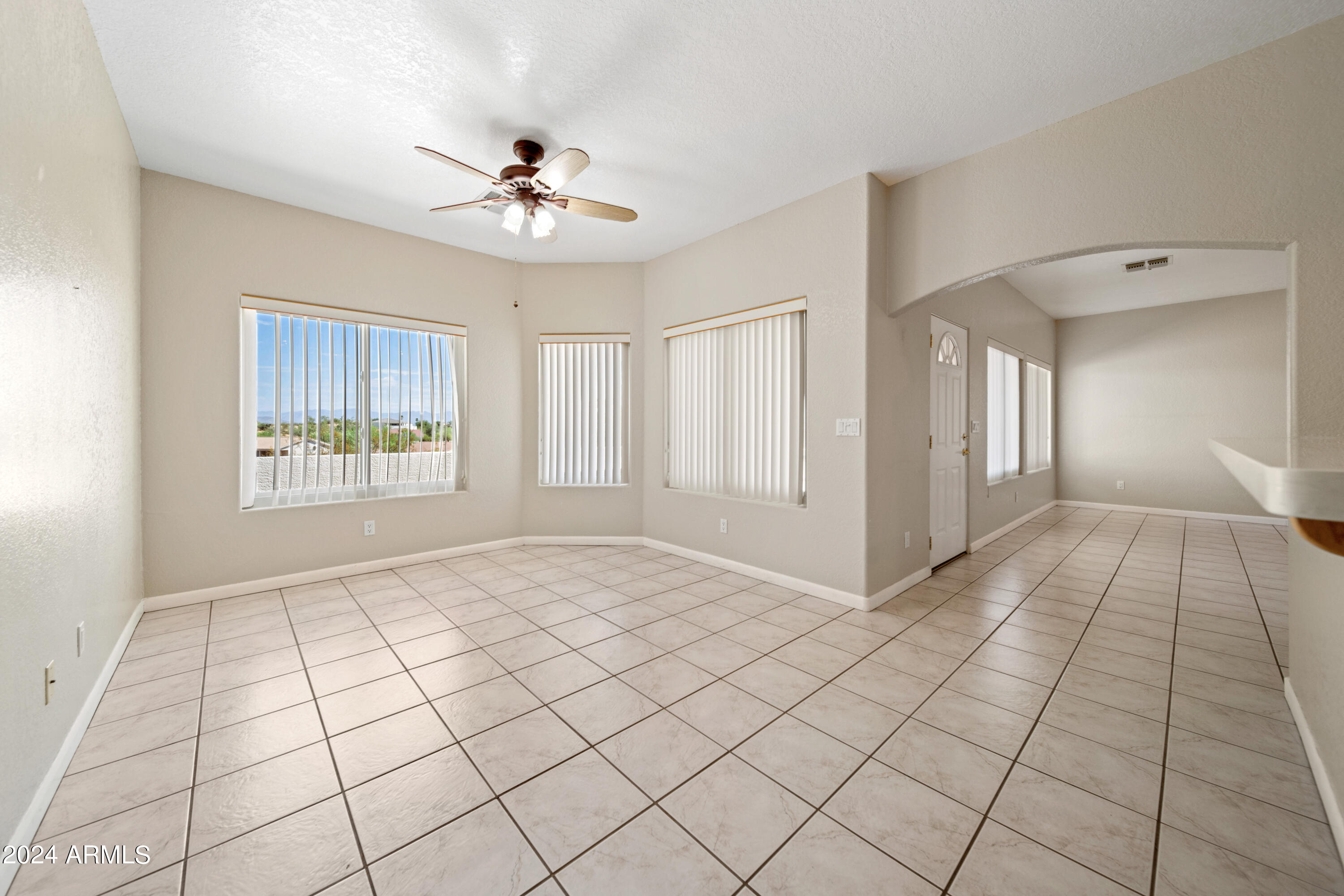 2825 West Pinto Place Wickenburg, AZ 85390 - Photo 7 of 32 a view of an empty room and window