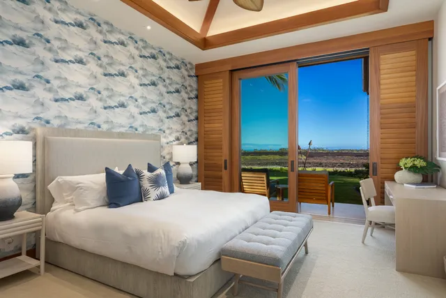 a bedroom with a large bed and a couch