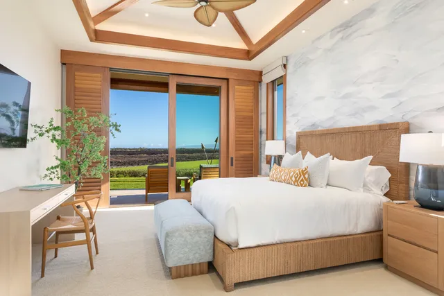 a bedroom with a bed and a night stand